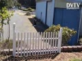 A mini white picket fence replaced